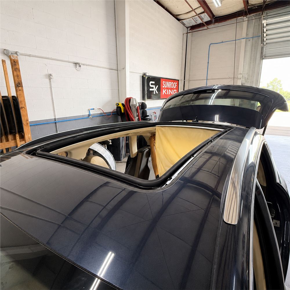 Panoramic sunroof open with the interior shade exposed during a Sunroof King repair
