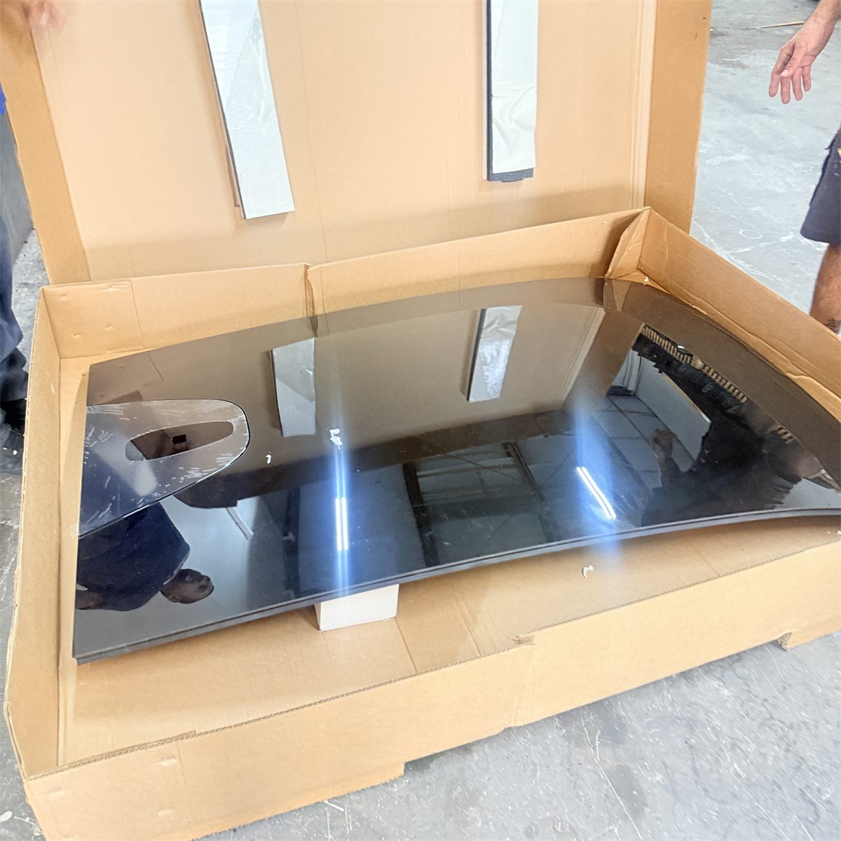 Replacement panoramic sunroof glass panel unpacked from its shipping carton at Sunroof King
