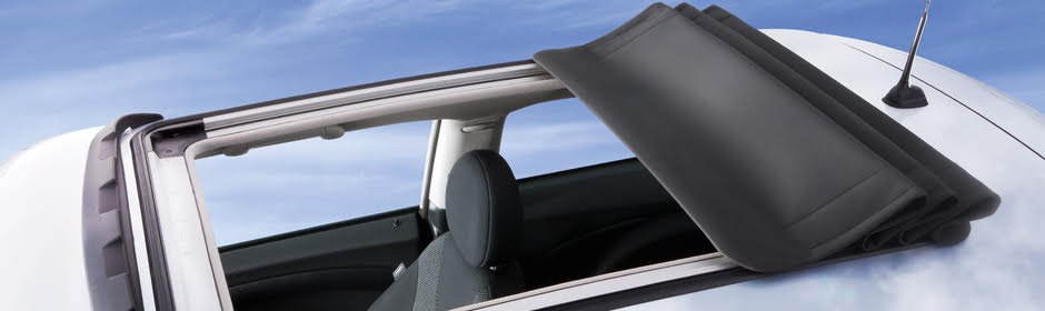 Folding fabric sunroof opened back along a vehicle roof